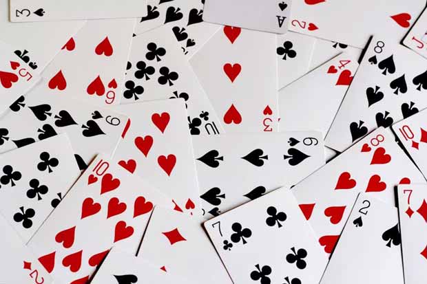 https://unsplash.com/photos/a-pile-of-playing-cards-with-hearts-and-spades-EKK-08sYimw